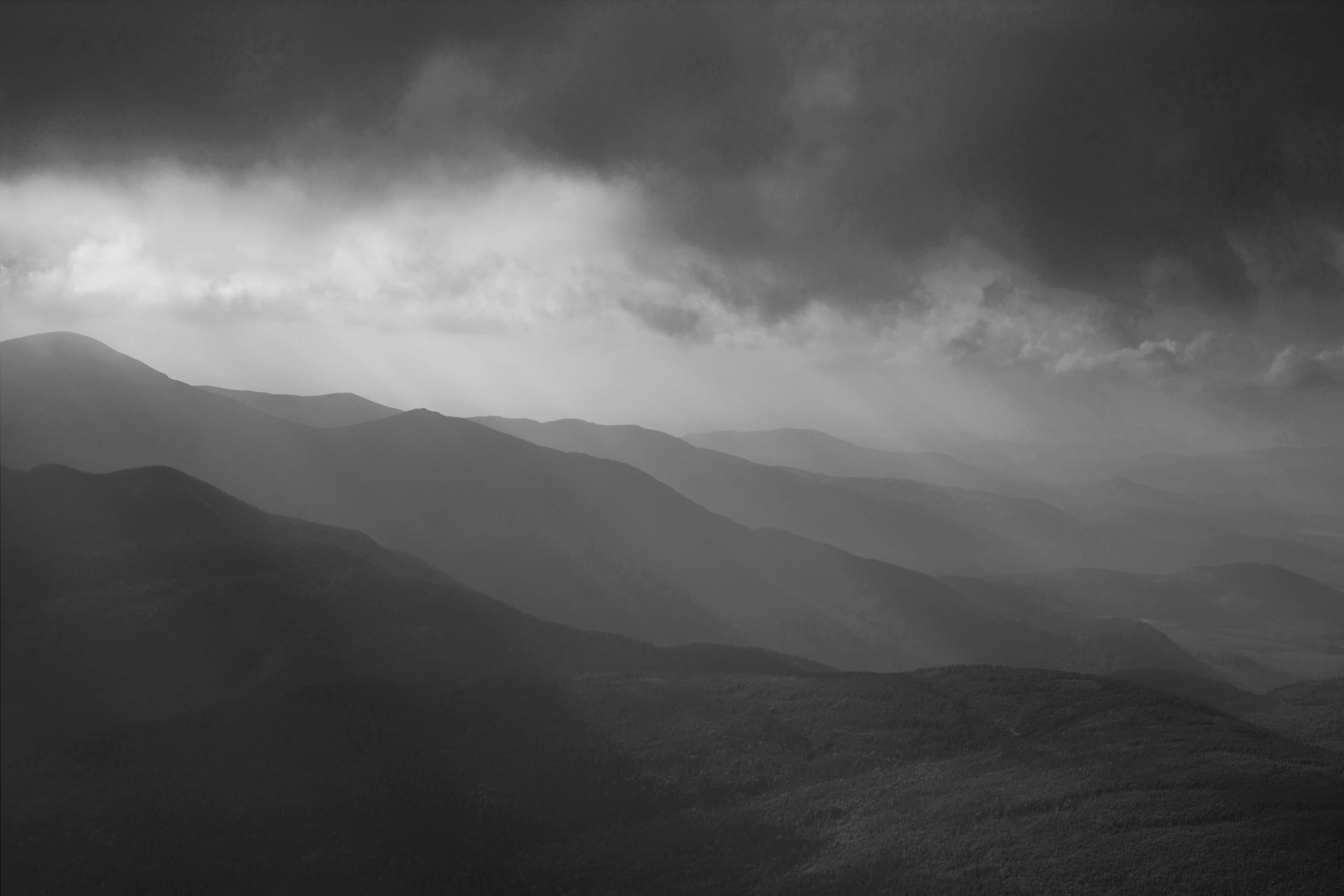 a black and white photo of a mountain range